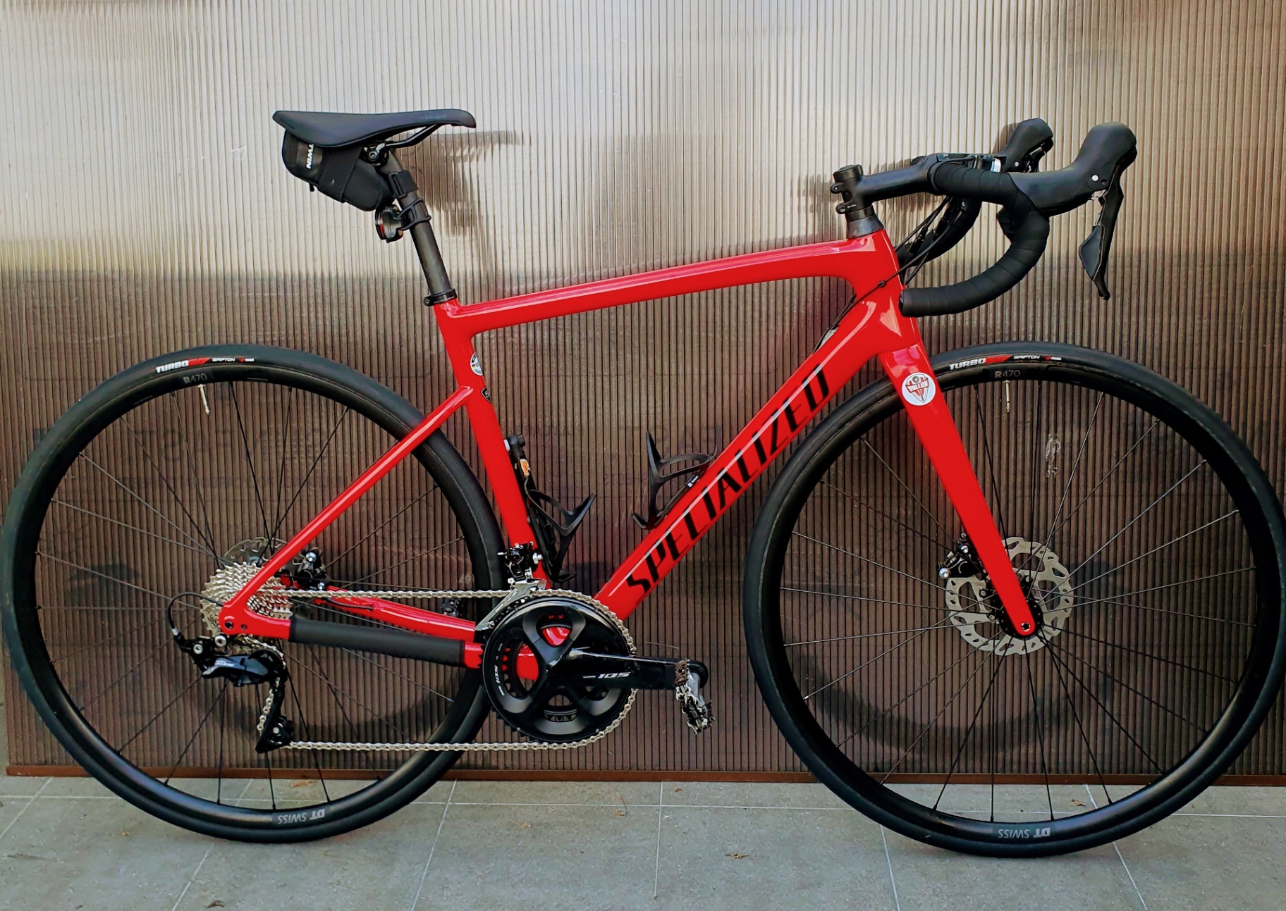 Red Specialized carbon road bike with disc brakes